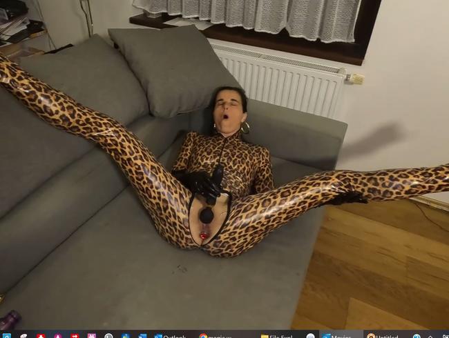 I enjoy, dressed in my leopard catsuit, fucking myself with my magic wand