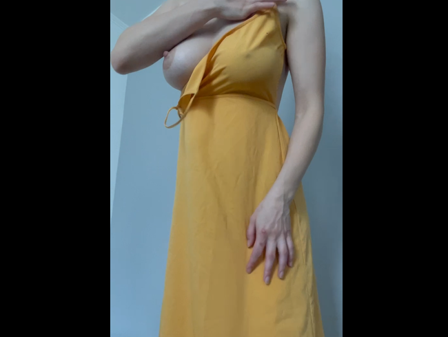 yellow dress where I show a striptease without a bra.